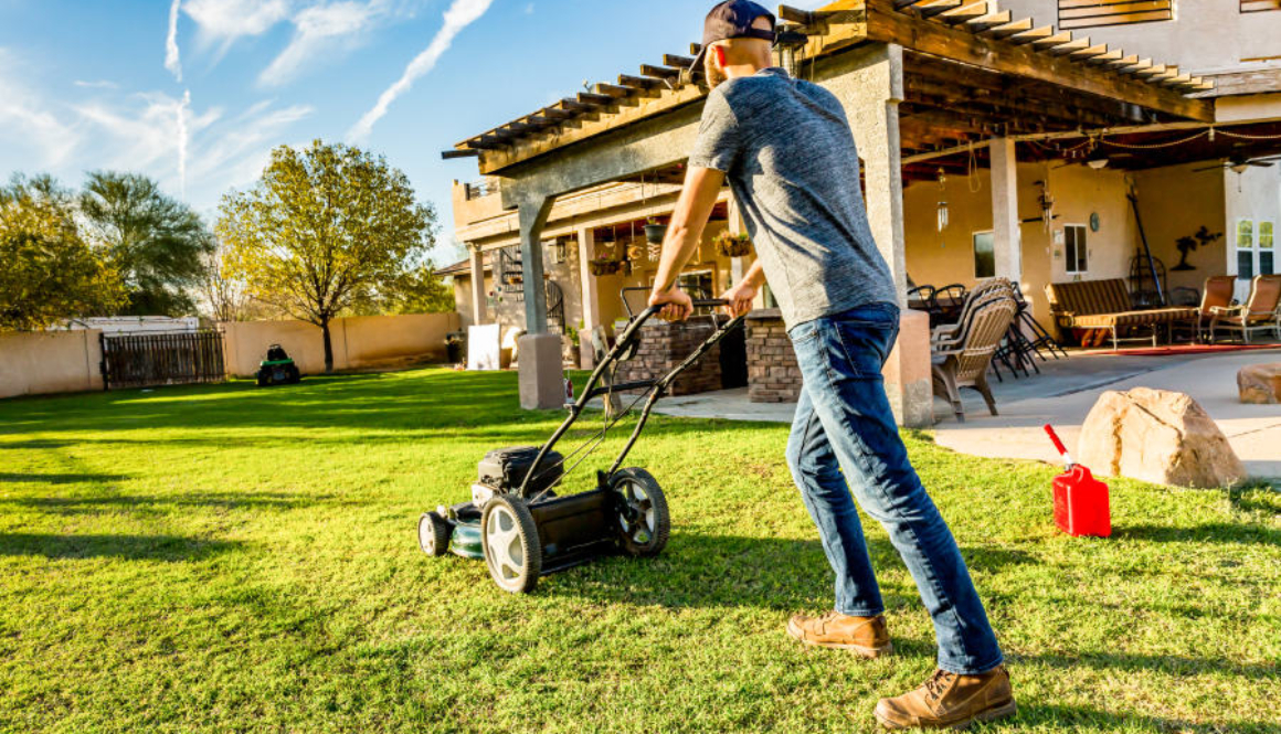 A man mowing a lawn